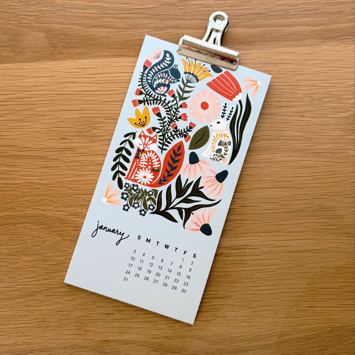 2027 desktop calendar - showing with a bulldog clip for a hanging display